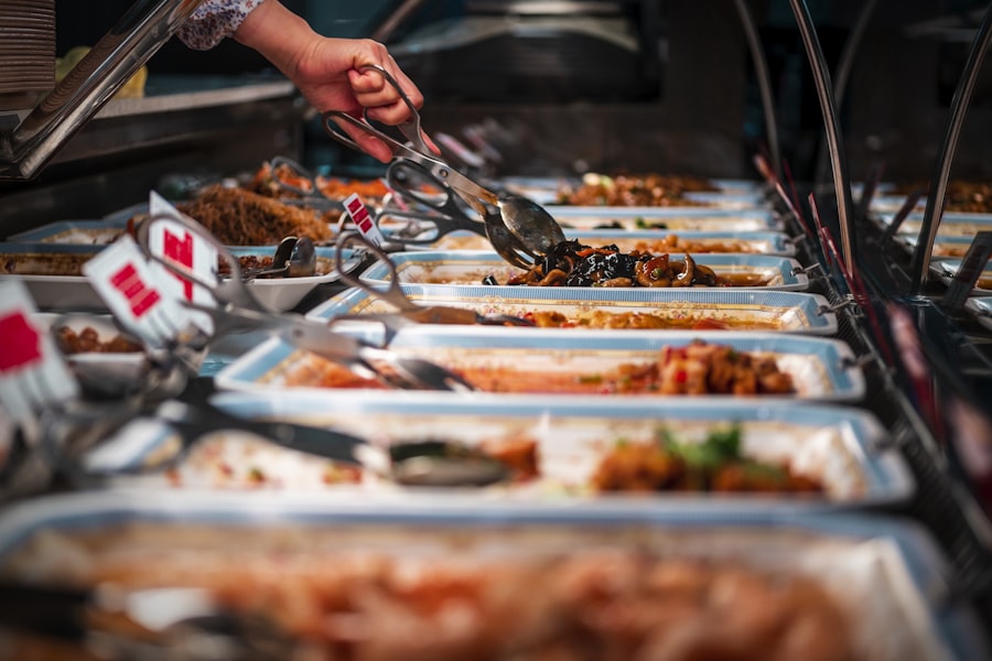 Guests serving from a full buffet line with tongs