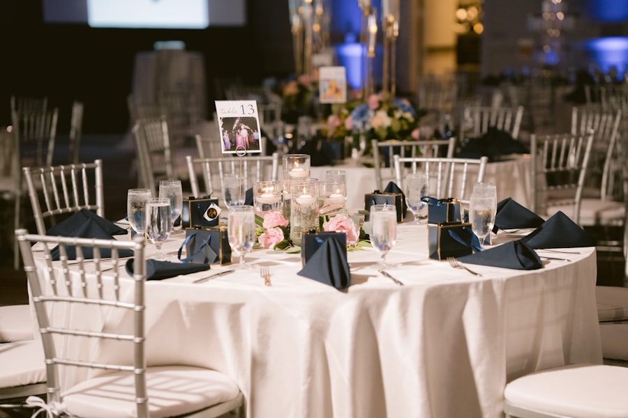 Elegant event guest table with white linens and floral centerpiece